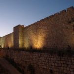 Barbarians at the Gate: Where do We Turn? Weekly Blog Post by Dr. Craig Biehl - stone wall of Jerusalem lite up