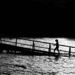 Presuppositions of Faith (1 of 6): Faith as the Basis of Reason - women on bridge in lake black and white