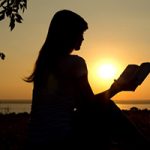 Wisdom Concerning the Secret and Revealed Things - women reading Bible in sunset