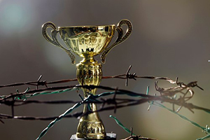 The Father’s Conditional Love of Christ - Weekly Blog Post by Dr. Craig Biehl - barbed wire surrounding gold cup