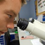 The Limits of Scientists and the Scientific Method - Weekly Blog Post by Dr. Craig Biehl - man looking into microscope