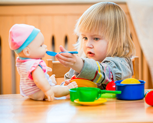 Gleanings from The Religious Affections (Part 26): Distinguishing Sign Eleven: True Affections Desire Growth, False Affections Rest Satisfied - Weekly Blog Post by Dr. Craig Biehl - girl feeding a doll