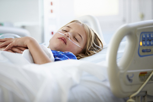 The Human Limitations of Unreasonable Atheism (Part 8): Pain and Evil - Weekly Blog Post by Dr. Craig Biehl - Young Girl Sleeping In Intensive Care Unit